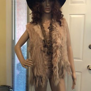 Dolce Cabo raccoon and rabbit vest.